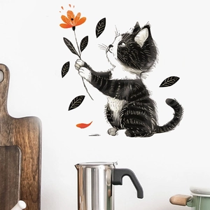 Cartoon black cat wall sticker holding orange flower on white kitchen tile wall