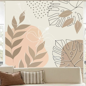 Detail of tropical leaf and sun mural wallpaper showing earth tones and boho patterns