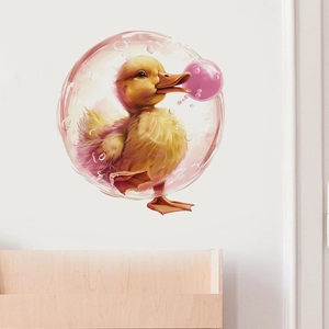 Detail of yellow duckling in pink bubble wall sticker on white nursery room wall