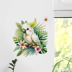 Detail von Kakadu-Wandaufkleber mit tropischen Blättern und Blumen bei Tageslicht