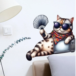 Detail of funny cartoon cat wall sticker with sunglasses and vintage TV on white wall