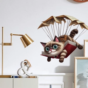 Cartoon kitten gliding with book pages wall sticker for living room and bedroom decor
