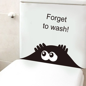 Cartoon monster toilet sticker with Forget to wash text on white ceramic tank