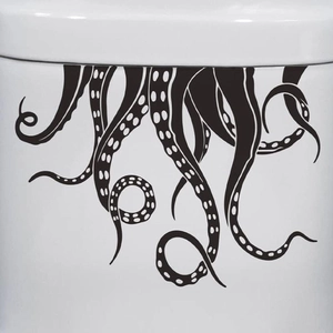 Close-up of black octopus tentacle stickers with suction cups on a ceramic surface