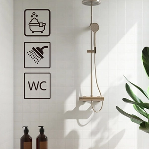 Black minimalist bathroom and WC door stickers on white tiles with natural shadows
