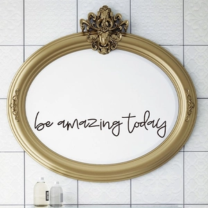 Detail of 'be amazing today' black cursive wall decal applied to a vintage mirror surface