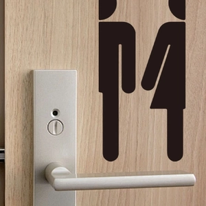 Detail of creative black PVC restroom door stickers showing minimalist man and woman figures