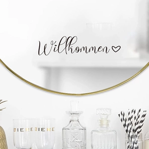 Modern Willkommen decal with heart on a gold round mirror for bathroom decor