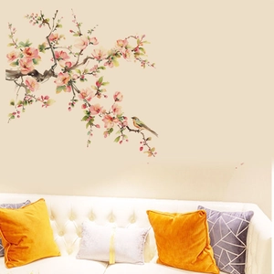 Detail of floral wall sticker featuring a colorful bird on a pink blooming flower branch