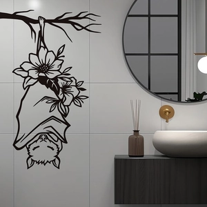 Minimalist black bat and flower wall sticker on white marble tiles in a modern bathroom