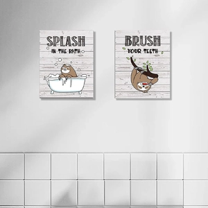 Detailed view of two-piece cartoon sloth bathroom wall stickers on white tile background