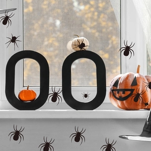 Detail of diverse black spider wall stickers for Halloween home and window decoration