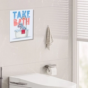 Close-up of bathroom wall sticker with cute cartoon hippo in bathtub and Take a Bath text