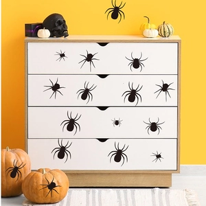 Creepy Halloween spider wall decals set on white dresser with spooky holiday decor