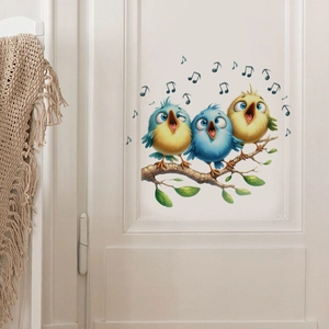 Detailed view of colorful cartoon birds and musical notes wall stickers on a white door