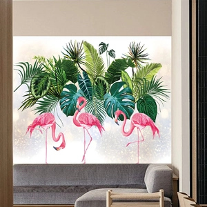 Detail of pink flamingo wall stickers with tropical palm leaves in a modern living room