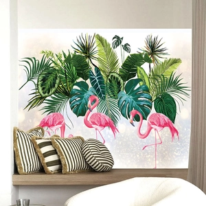 Detailed view of tropical flamingo wall stickers with green palm leaves in a cozy room
