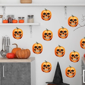 Detail of vivid orange Halloween pumpkin skull wall decals on a minimalist kitchen wall
