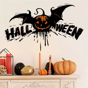 Close-up of Halloween pumpkin wall sticker with bat wings on a white wall decor