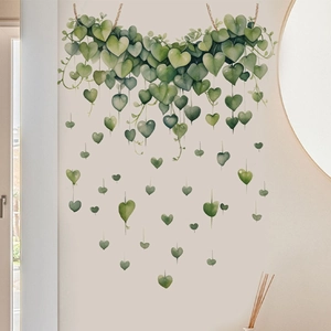 Close-up of heart-shaped green leaf wall stickers with delicate watercolor texture effect