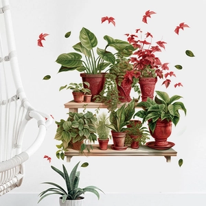 Detail of multi-layered potted plant wall stickers with leaves on a white wall