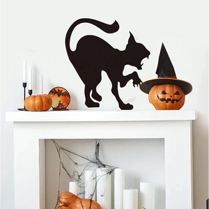 Detail of black cat silhouette wall sticker for Halloween decor on white fireplace