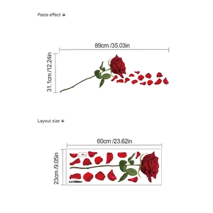 Detail view of red rose wall decal layout with leaves and falling petals for bathroom decor