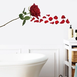 Detailed view of red rose floral PVC bathtub stickers and floating petals in bathroom decoration