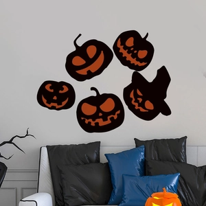 Halloween pumpkin wall stickers set with five cartoon designs on a modern living room wall