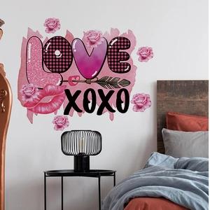 Detail view of Valentine's theme wall decals with pink roses, hearts and LOVE text in a bedroom