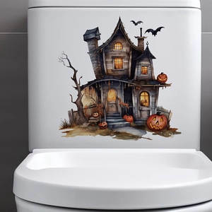 Detailed view of Halloween pumpkin and haunted house stickers applied on a toilet tank