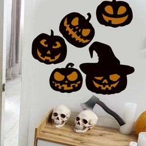 Close-up of spooky glowing pumpkin wall stickers set against a modern interior wall background