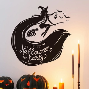 Detail of Halloween witch on broom and bat wall decals with Happy Halloween lettering