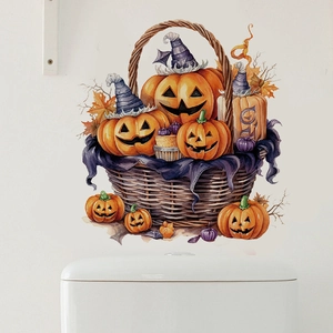 Detail of Halloween pumpkin basket decals with wizard hats on a white bathroom wall