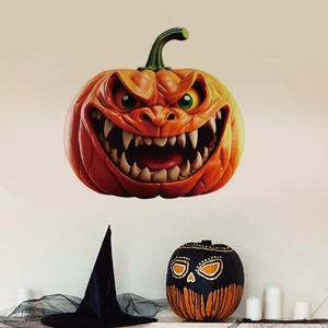 Close-up of a 3D scary Halloween pumpkin wall sticker with sharp teeth and green eyes