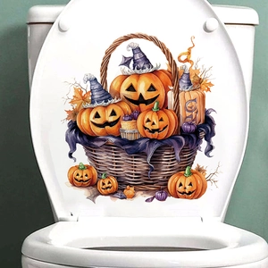 Close-up of Halloween pumpkin basket sticker with wizard hats on a white toilet lid