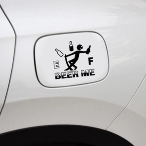 Detail shot of creative black beer fuel tank decal on white car with E and F gauge indicators