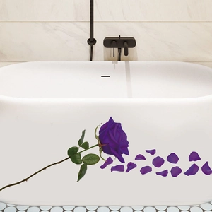 Self-adhesive purple rose stickers with petals on white bathtub in modern bathroom decor