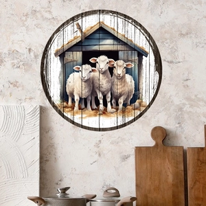 Detail of round rustic farm wall decor featuring three sheep near a blue farmhouse