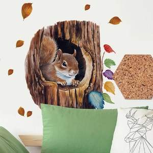 Detail of squirrel in tree hole wall sticker with colorful autumn leaves on a white wall