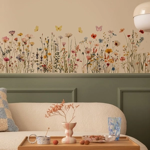 Detail of floral wall stickers with butterflies on a living room sofa background