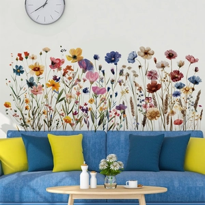 Vibrant watercolor wildflower wall stickers for living room decor on a blue sofa wall