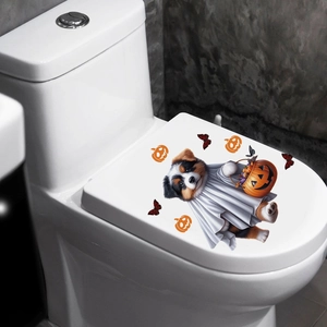 Close-up of Halloween Australian Shepherd ghost and pumpkin decal on white toilet lid