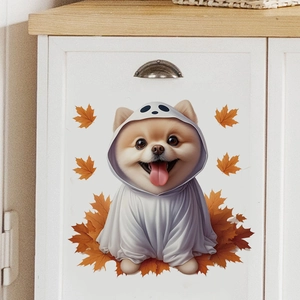 Detail of cute Halloween puppy in ghost costume and orange maple leaves sticker on cabinet