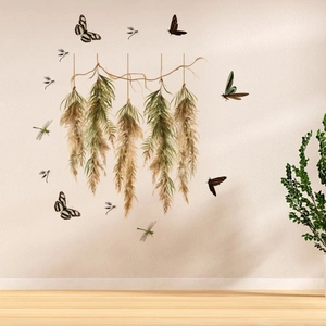 Detail of dried plant wall stickers with flying butterflies and dragonflies on white wall