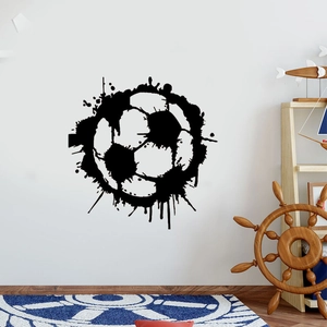 Detailed view of soccer wall sticker in black splatter art style on white bedroom wall