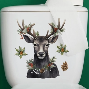 Detail of Christmas reindeer toilet sticker with pine needles and red berries on a white tank