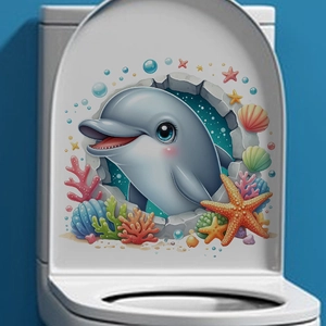 Détail de l'autocollant dauphin 3D avec coraux et étoile de mer sur abattant de WC blanc
