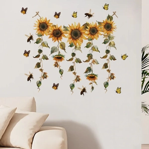 Detail of sunflower wall stickers with green vines, butterflies, and bees on white wall