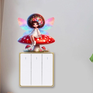Detail of fairy wall sticker on a light switch featuring a cute elf on a red mushroom